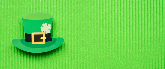 St Patricks Day hat on green background banner with copy space