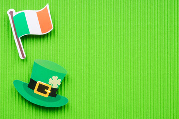 St Patricks Day symbols on green background with copy space