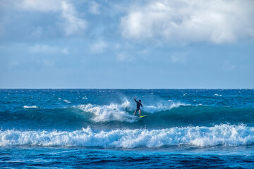Surfing at Ho'okipa Beach Park, Maui, Hawaii, USA.