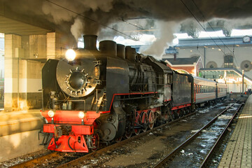 Steam locomotive at the station ready to go on a retro trip.
