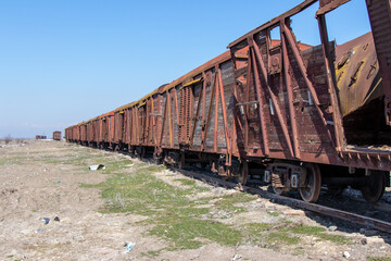 Obraz premium War crime. Train wagon destroyed by rocket fired by the Armenian arm in Agdam. Crash on railway.