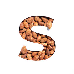 Letter S of English alphabet made of almonds and paper cut isolated on white. Typeface from nuts