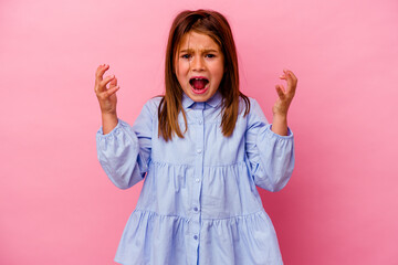 Little caucasian girl isolated on pink background  screaming with rage.