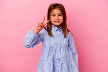 Little caucasian girl isolated on pink background  showing number two with fingers.