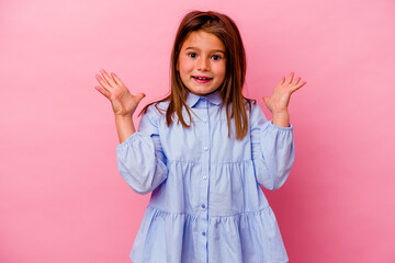 Little caucasian girl isolated on pink background  celebrating a victory or success, he is...
