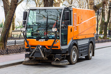 Garbage collection machine on the city streets. The problem of cities is a lot of rubbish. The sweeper works instead of the windshield wipers.