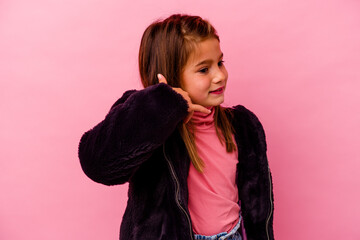 Little caucasian girl isolated on pink background