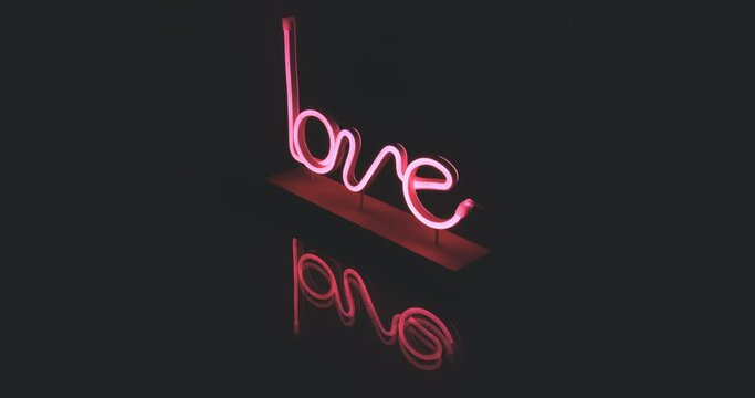 Neon Flashing Pink Purple Love Text Sign with Flicker on Black Background.Text Love of Valentines Message by Neon Lamp. Modern Trend Design, Night Neon Signboard Black Background