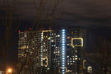 Fototapeta premium interesting unusual night illumination of a residential building