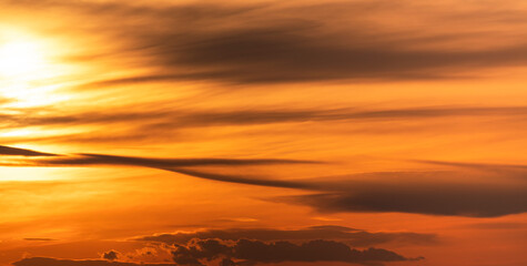 Beautiful dark orange sky with clouds after sunset. Nature sky sunset background.