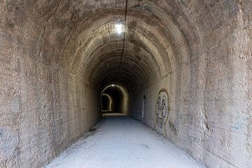 Fototapeta na wymiar Tunnel of an old train track, nowadays converted into a greenway, in Alcoy (Alicante, Spain).