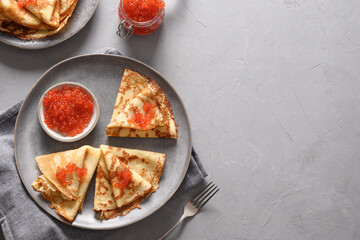 Russian blini with red caviar. Shrovetide. Maslenitsa traditional Russian festival meal. View from above.