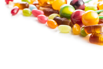 Various colorful candies. Lollipops, jelly beans and gummy bonbons.