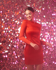 Beautiful lady in red sexy dress with make-up and elegant hairstyle. Pretty brunette woman posing...