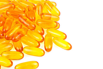 Pile of capsules Omega 3 isolated on a white background. Fish oil tablets, close up.