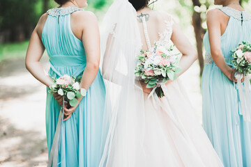 Bride holding big and beautiful wedding bouquet with flowers