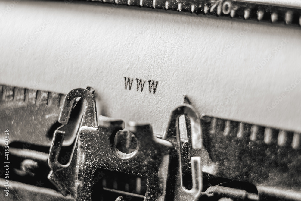 Fototapete text www printed with black inks on white paper on vintage typewriter. concept of combining old and 