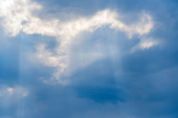 Sunbeams falling from the clouds