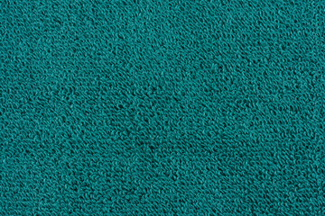 Closeup of a green towel. textile details backdrop