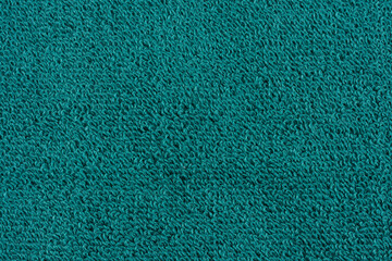Fototapeta premium Closeup of a green towel. textile details backdrop