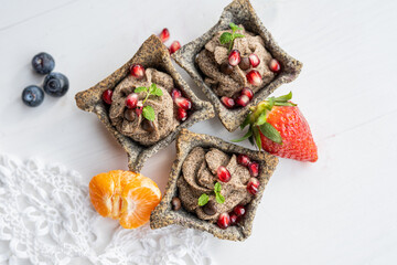 coffe cream poppy seed tartlets cake with fresh fruit 