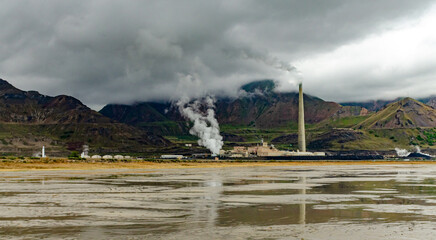Fototapeta premium Oil refinery and a factory for obtaining silver on the shore