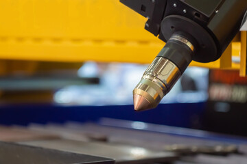 Automatic cnc laser cutting machine working in demo mode: close up. Industrial, equipment, technology, manufacturing concept