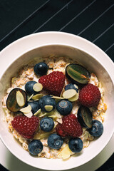 Healthy breakfast cereal,Oatmeal Porridge With Fresh Blueberry And Raspberry.Top view.