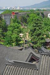 China, Nanjing,Jiming Temple ceiling and the ancient city wall. The temple is a place of harmony and serenity. 