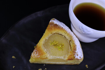 close up Pear Tart on Black background