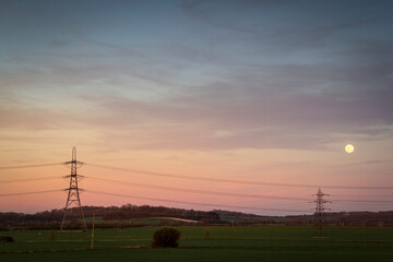 Fototapeta na wymiar Rural pylons silhouette at sunset
