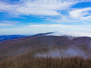 Fototapeta premium clouds, blue sky, haze over the mountains.