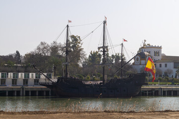 Replica of the Spanish galleon that traveled and discovered America for the first time. Old ship moored at a jetty on the Guadalquivir river in Seville (Andalusia, Spain).