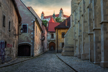 Farska Street in Historical Centre of Bratislava, Slovakia at Sunset with Bratislava Castle in Background