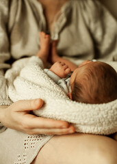 baby in mother's arms