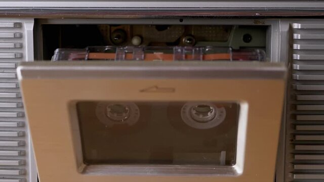 Open and Close a Vintage Tape Recorder with Old 90s Cassette Inside. Zoom