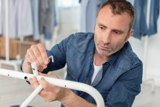 man uses furniture allen key hexagon