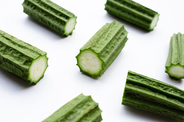 Fresh luffa vegetables on white background.
