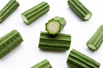 Fresh luffa vegetables on white background.
