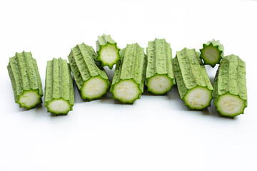 Fresh luffa vegetables on white.