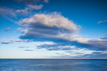 Fototapeta na wymiar USA, Maine Cape Elizabeth. Clouds over Casco Bay.