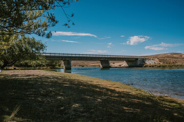 View of a large concrete bridge from below.