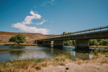 View of a large concrete bridge from below.