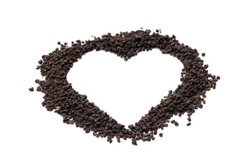 black tea granules isolated on white background. design element. heart symbol made by dry tea heap cut out