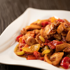 Bowl of juicy food portions hearty lunch. Food plate, vegetable stew with meat on wooden background. Food concept. Square format or 1x1 for posting on social media. Soft focus. Close up shot.
