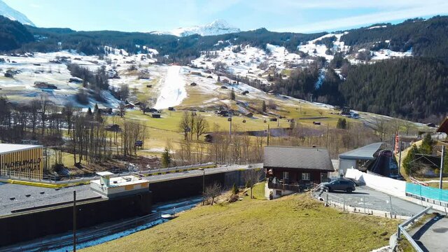 The stadium of the ski jumping hill tower and the track. In the background the city of Innsbruck