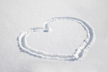 Hand drawn heart in the winter snow