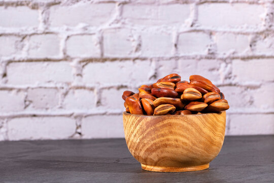 Dried fava beans in the wooden bowl - Vicia faba L.