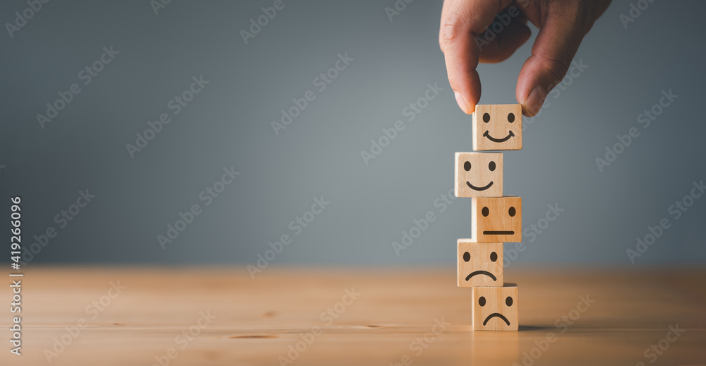 Wall mural customer service and satisfaction concept ,business people show a feedback with smile face wood cube