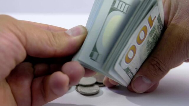 slowmo of bills and hands